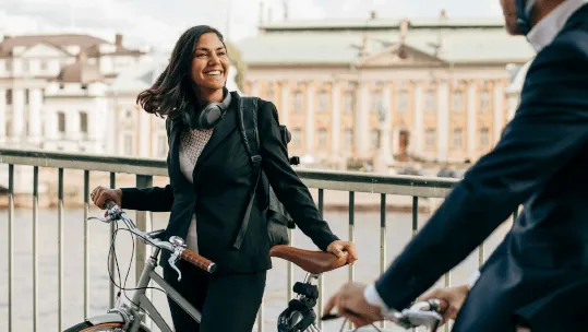 business woman smiling on her bike