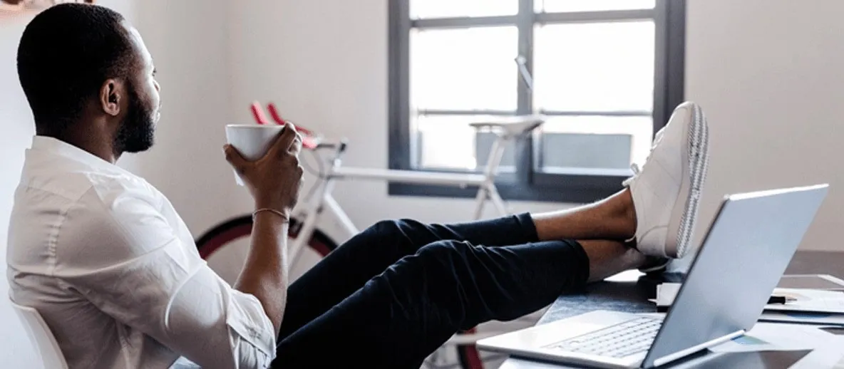 man at desk and relaxing at work