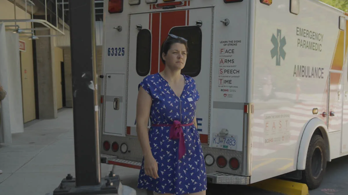 Australian expat Simone walking behind a Canadian ambulance