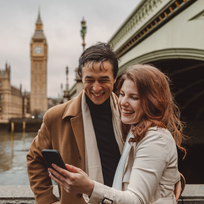 Two people clicking pictures in Westminster